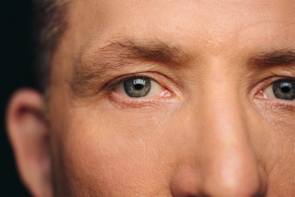 Close up of a mans face and eyes