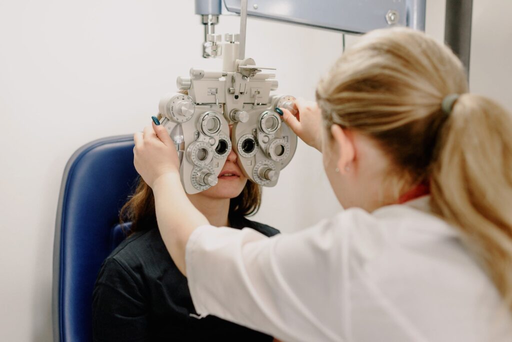 Opthamologist checking the vision of a patient